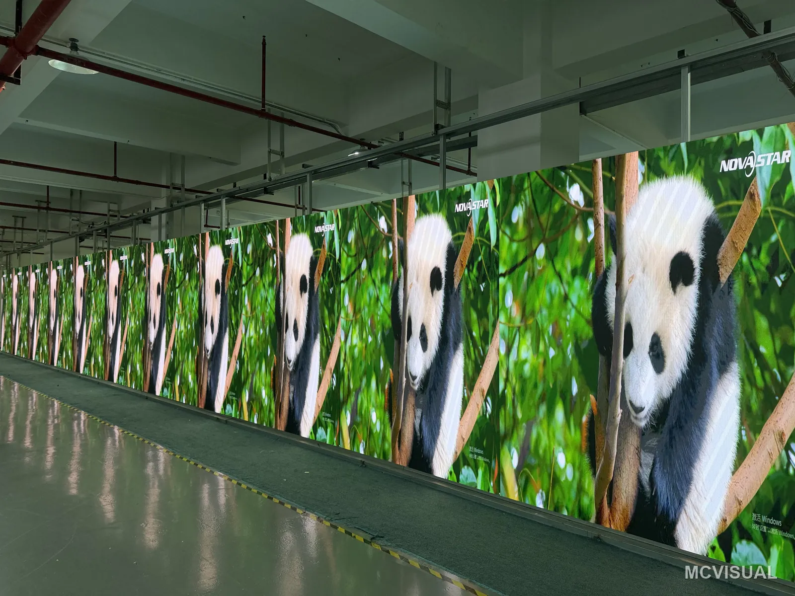 MCVISUAL factory aging bay, Shenzhen, China — 420 P1.25 GOB cabinets aged as one batch for 11 sites