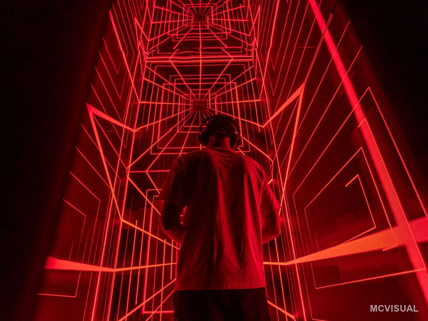 Immersive attraction, Bulgaria — Two walls meeting behind a visitor. Matched cabinets and a single calibration pass across all three surfaces are what st