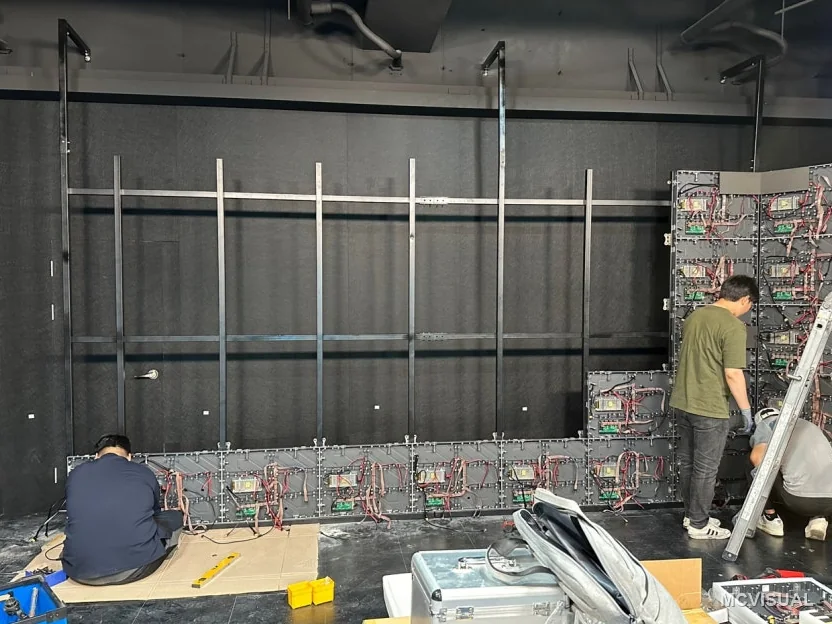 Video production studio, Doksan-dong, Seoul, South Korea — The support frame before modules are hung. On a curved wall the frame is the tolerance: modules follow whatever it does,