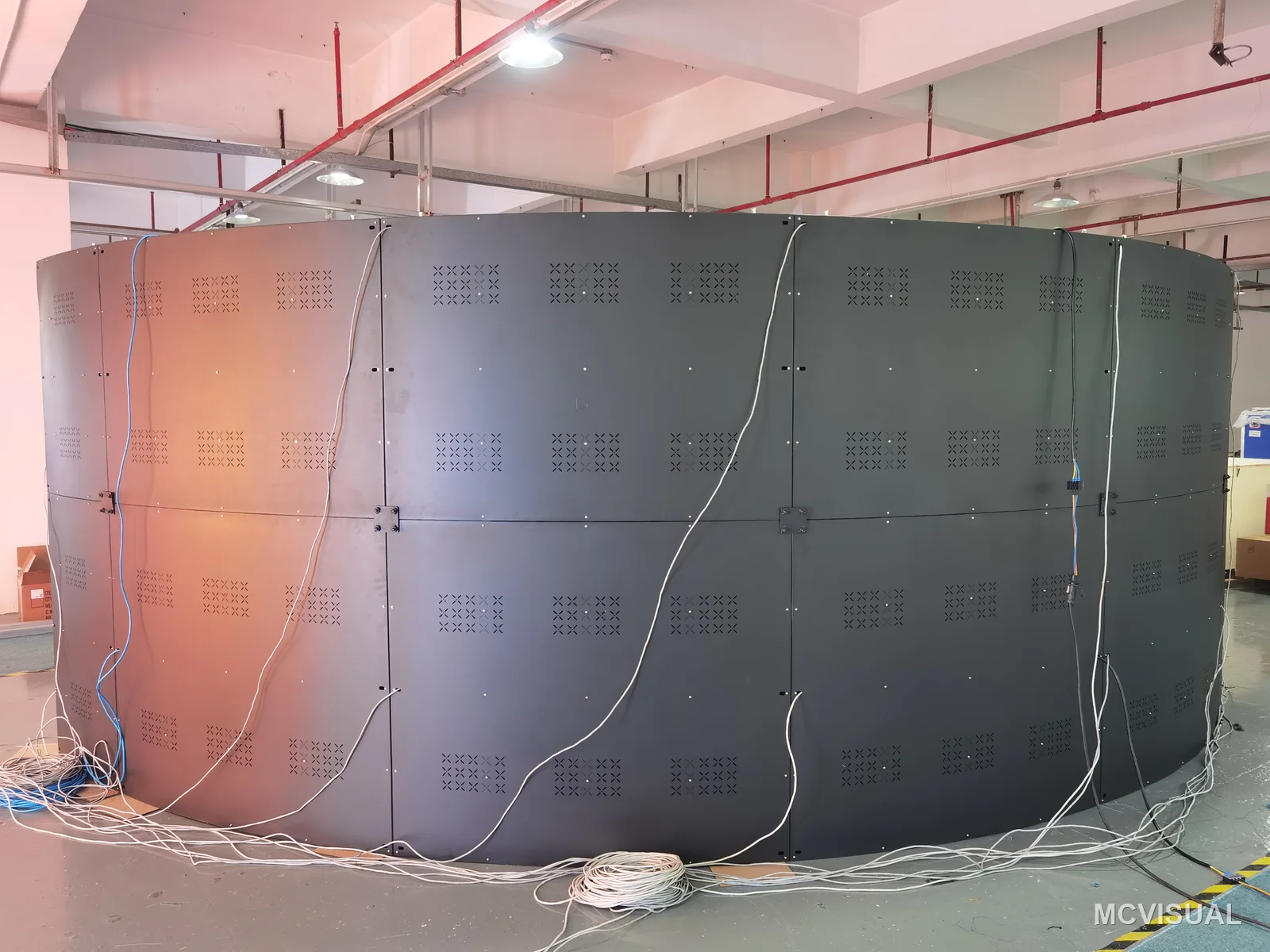 Immersive curved wall, factory build, Shenzhen, China — The complete 9600 × 2080 mm arc standing on the workshop floor. Building the whole curve before it ships is the point: i