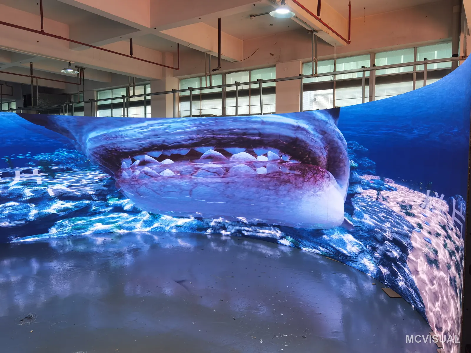 Immersive curved wall, factory build, Shenzhen, China — Panoramic content running the full width. A curve made from P1.53 flexible modules bends to the designed radius instead