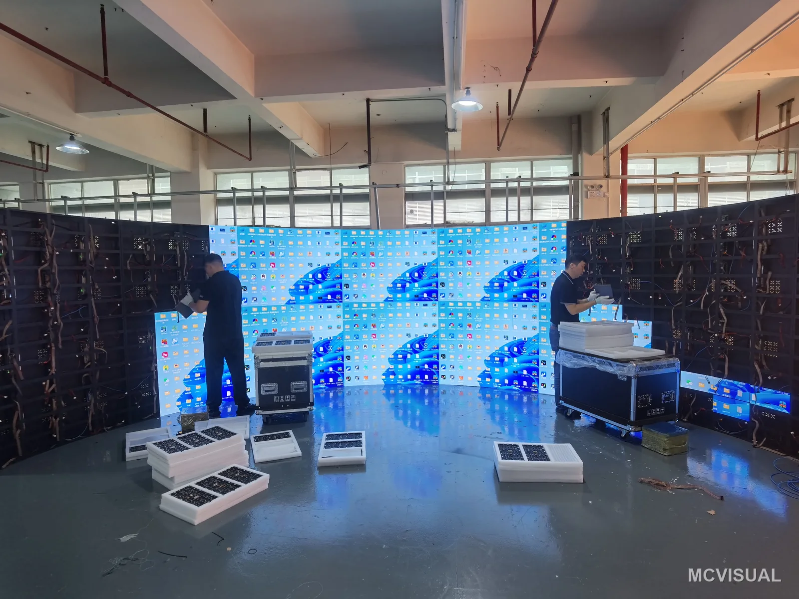 Immersive curved wall, factory build, Shenzhen, China — Modules and support frame mid-assembly. The frame sets the radius and the silicone module bodies follow it; get the fram