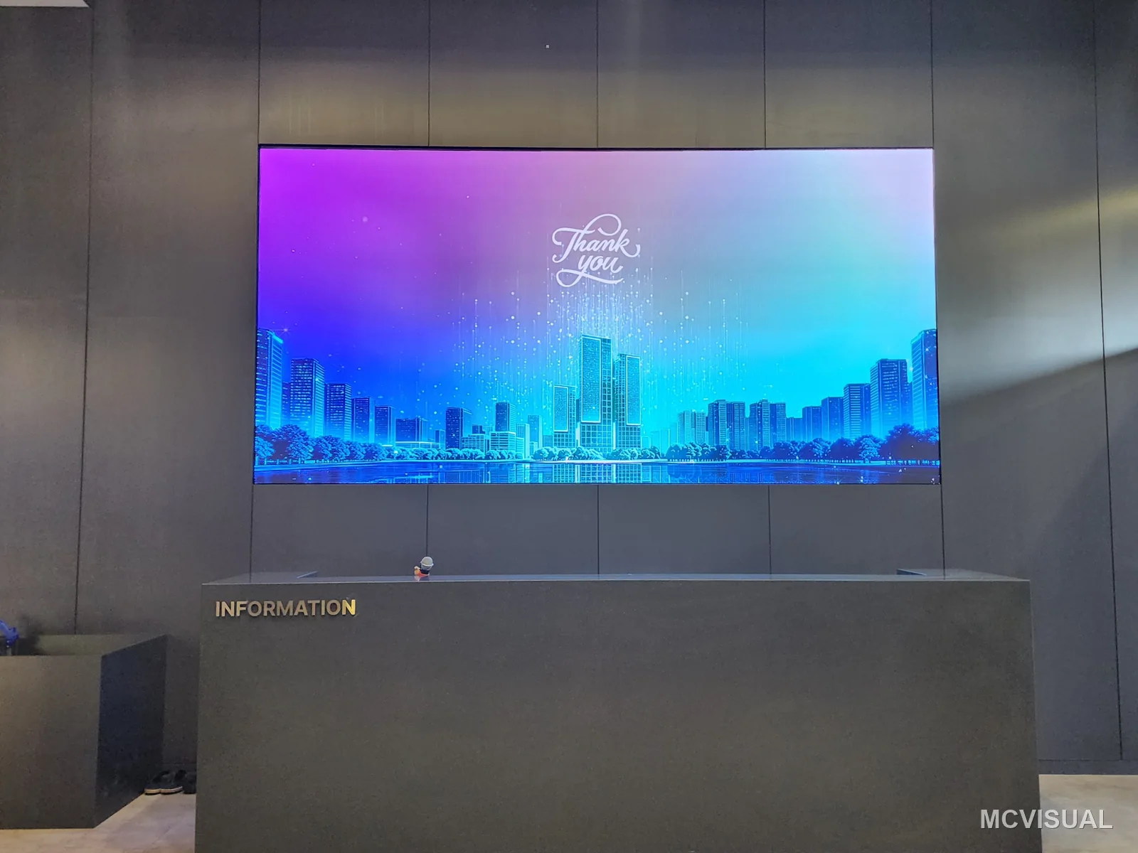 Property sales gallery, South Korea — The 3840 × 1920 mm screen behind reception, the first surface a visitor sees. It runs from the same processor set as the