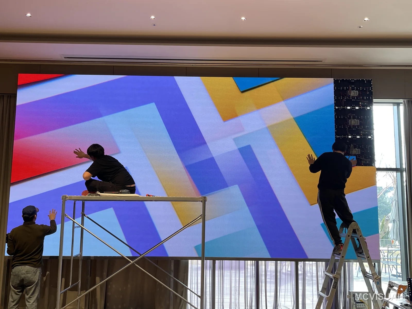 Multipurpose hall, South Korea — 5.8 × 2.9 m wall replacing projection in a daylit hall