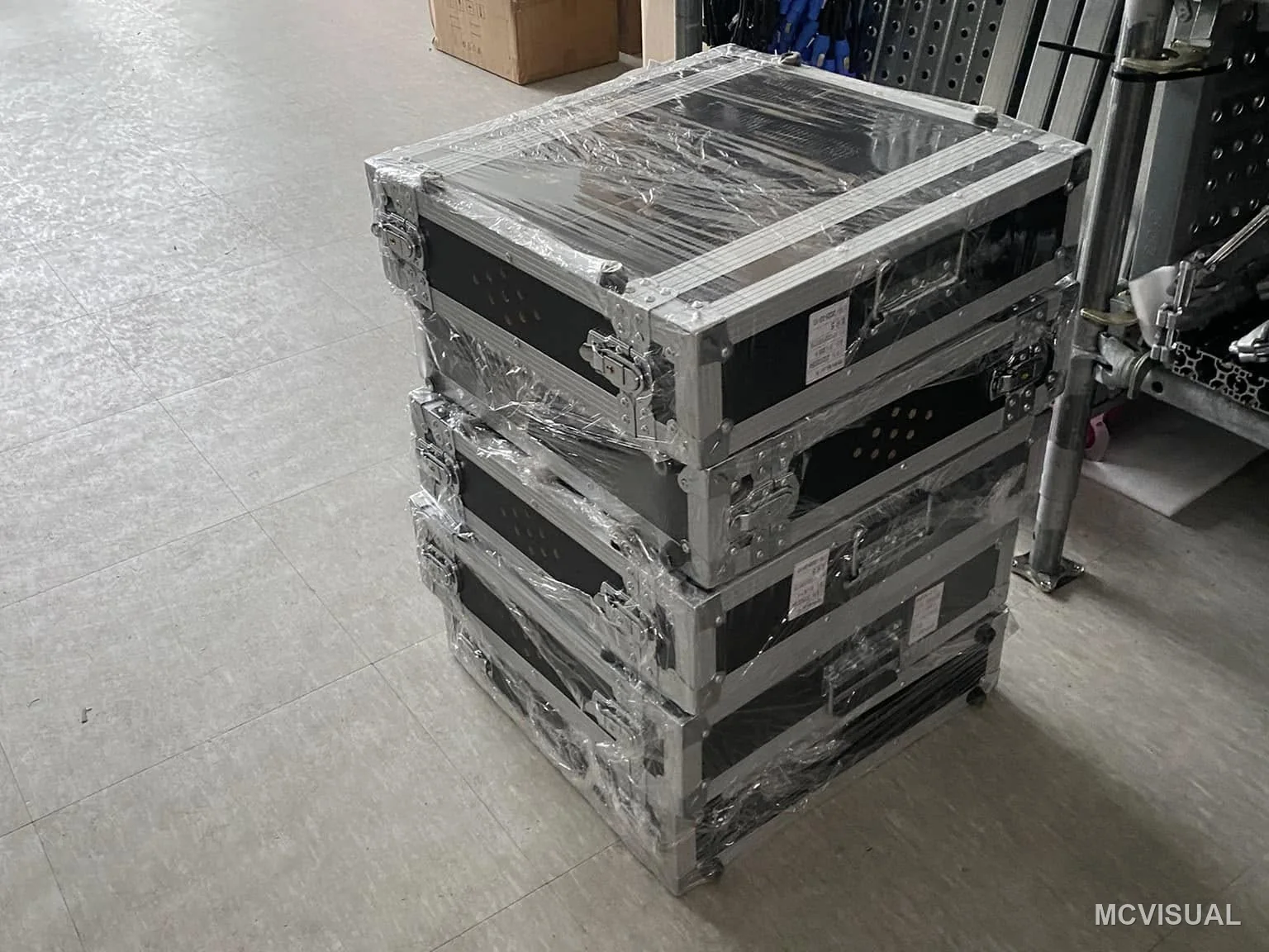 Retail concourse, South Korea — Cabinets arriving in flight cases sized for the lifts. Delivery format decides how fast a crew can move on a live constr