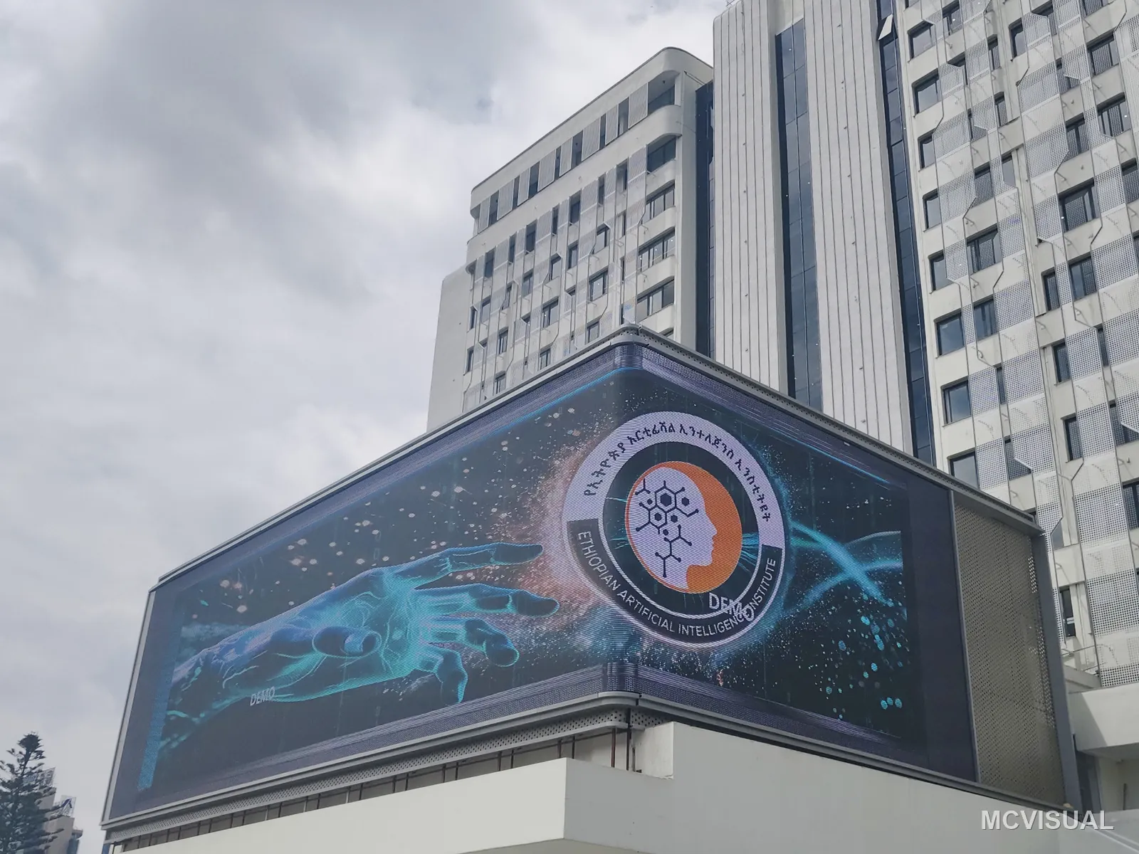 Tower facade advertising screen, South Korea — Running, read from street level. Brightness tracks ambient light, so the night level drops on its own — nobody has to re